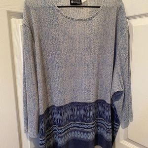 Maggie Barnes 3XWP women’s shirt in a variegated blue color.